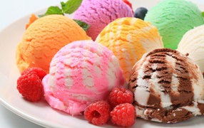 Multicolored ice cream with raspberry berries