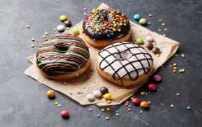 Three mouth-watering sweet donuts with sweets 