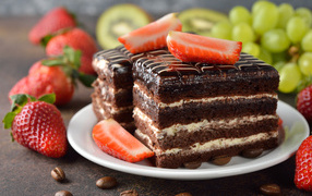 Two pieces of chocolate cake with strawberries