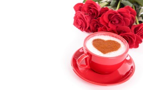 A cup of coffee with a pattern and a bouquet of red roses on a white background