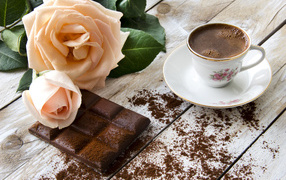Чашка кофе с черным шоколадом и розой 