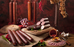 Appetizing sausages and bread on the table