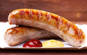 Sausage barbecue on the table with sauce