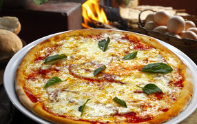 Hot pizza with tomato and cheese