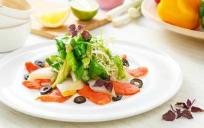 Appetizing salad with seafood on a white plate 