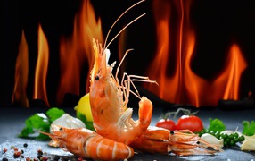Shrimp with spices on the background of fire