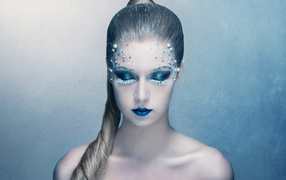 Beautiful girl with a fantastic blue makeup
