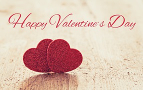 Два красных сердца на фоне надписи С Днем Святого Валентина