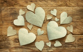 Paper hearts on a wooden table