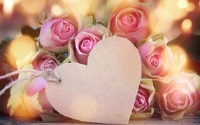 Paper pink heart with a bouquet of pink roses