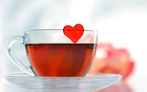 Red heart in a cup of tea