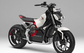 Быстрый мотоцикл  Honda Riding Assist-e Concept на сером фоне