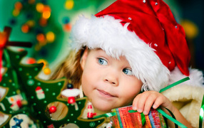 A cute little girl in Santa's hat