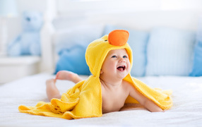 A little child in a duckling costume