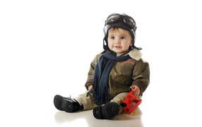 A little child in a pilot suit