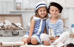 Boy and girl in clothes stylized as sailors