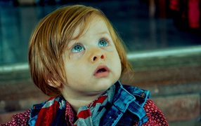 Cute blue-eyed child with red hair