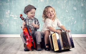 Little boy with violin and girl with accordion