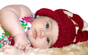 Little girl in red knitted hat