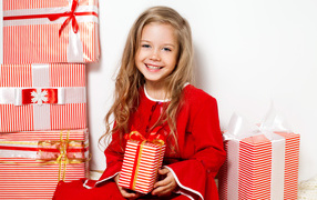 Little girl with Christmas gifts
