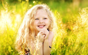 Little smiling girl in the sun