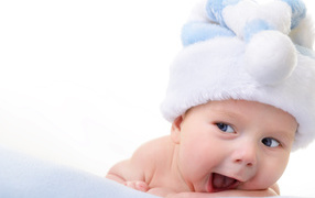Smiling baby in blue New Year hat