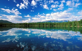 Clouds reflected in the lake in Jasper National Park, Canada