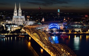 View of the Cologne Cathedral and the Hohenzollern Bridge in the evening, Germany