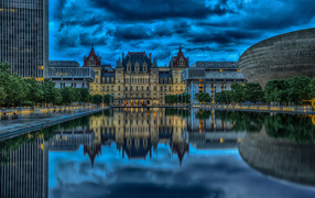 The New York State Capitol is reflected in the pond, Albany. USA