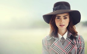 Actress Lily Collins in a big black hat