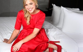 Smiling American actress Ariel Kebbel in a red dress