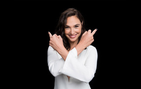 Smiling actress Gal Gadot photo on a black background