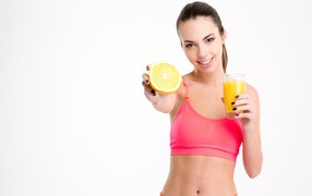 Sporty girl with orange juice