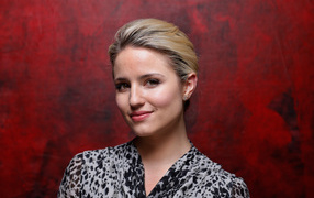 Stylish actress Dianna Agron photo on a red background