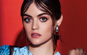 Young actress Lucy Hale, photo on a red background
