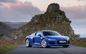Fast sports car Audi R8 V10, 2018 against the background of the rock