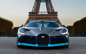 Car Bugatti Divo on the background of the Eiffel Tower in Paris