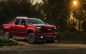 Red 2018 Chevrolet Silverado RST Off Road Concept pickup truck in the woods