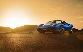 Blue car convertible Ferrari 488 Spider at sunrise