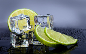 Cold ice cubes with slices of lime