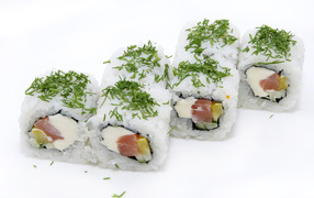 Rolls with rice and greens on a white background
