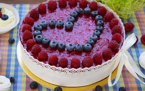 Appetizing cake with raspberries and blueberries