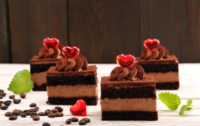 Appetizing chocolate cakes with red hearts