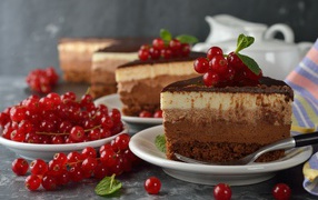 Appetizing pieces of a cake with berries of a red currant