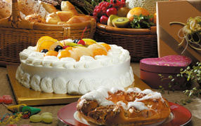 Beautiful white cake with a pie on the table