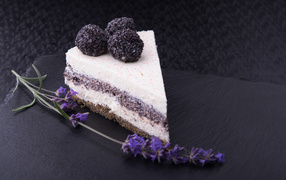 Cake with a sprig of lavender on a gray background