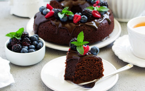 Chocolate cupcake with icing and berries