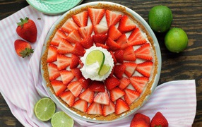 Delicious pie with cream, strawberry and lime