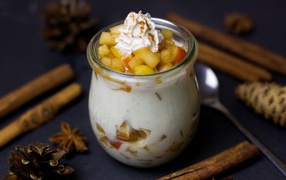 Dessert yogurt with fruit on the table with spices