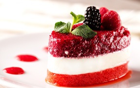 Fruit dessert with mint and fresh berries of raspberry and blackberry